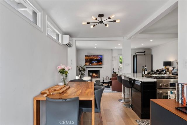 a view of a dining room with furniture and a livingroom