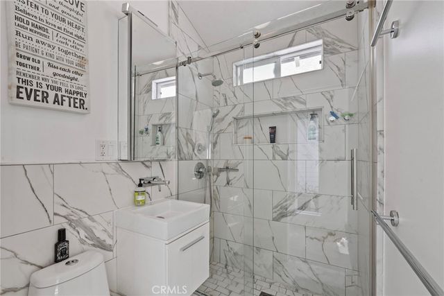 a bathroom with a bathtub and shower