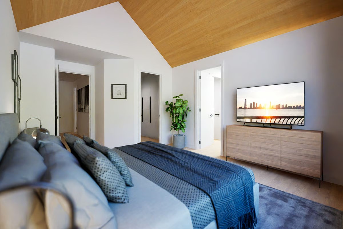 2004 Ballinger Drive Spicewood, TX 78669 - Photo 15 of 30 Bedroom with vaulted ceiling and wood floors to add warmth.