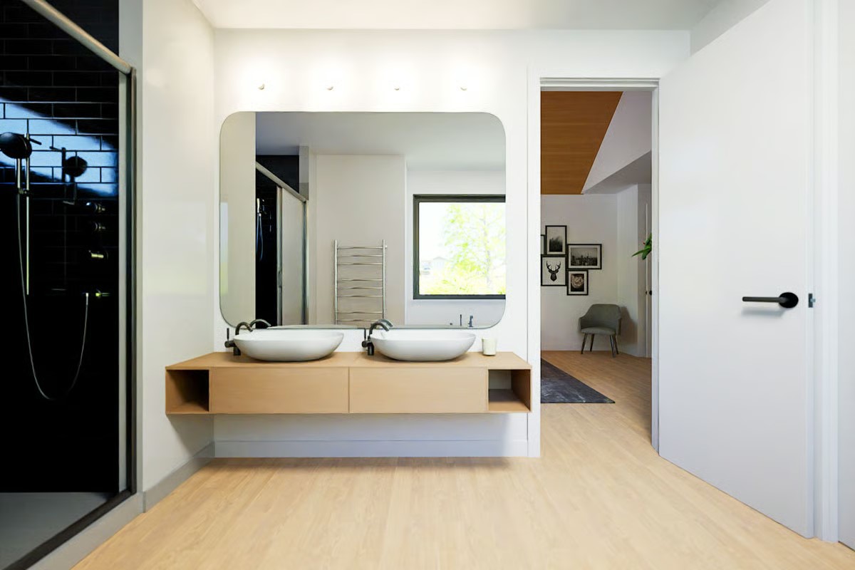 2004 Ballinger Drive Spicewood, TX 78669 - Photo 16 of 30 Modern ensuite bath featuring a floating dual-sink vanity and walk-in shower.