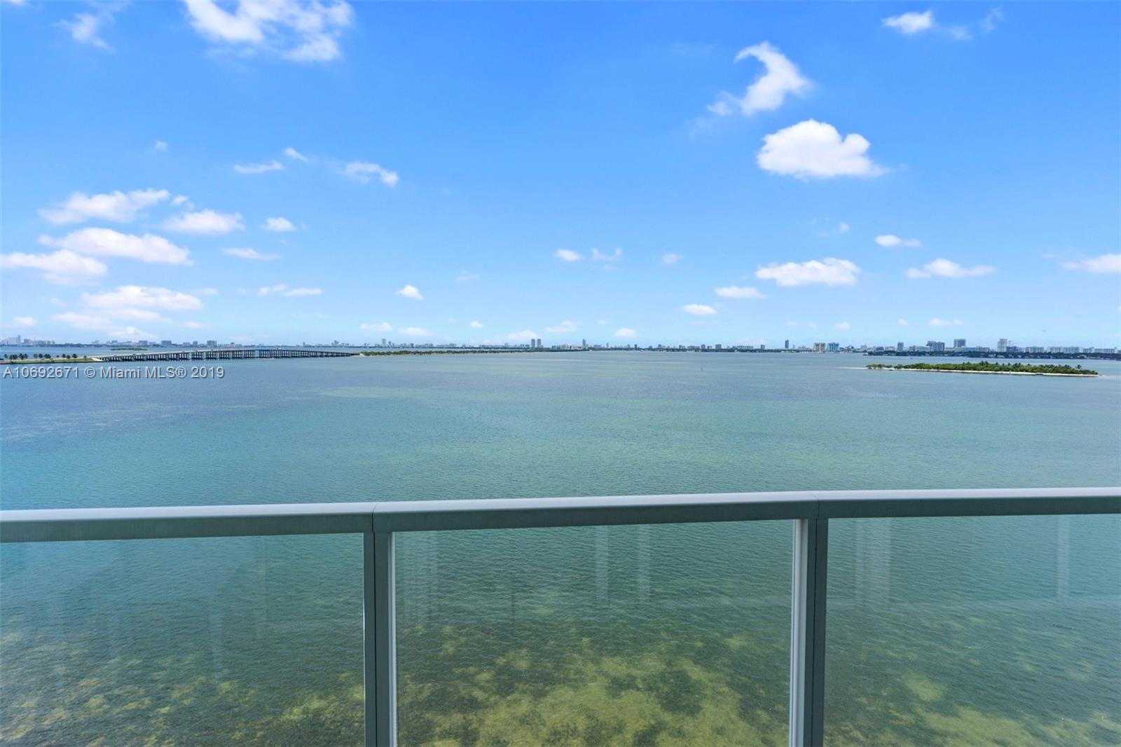 665 Northeast 25th Street, Unit 802 Miami, FL 33137 - Photo 1 of 24 a view of a lake from a yard