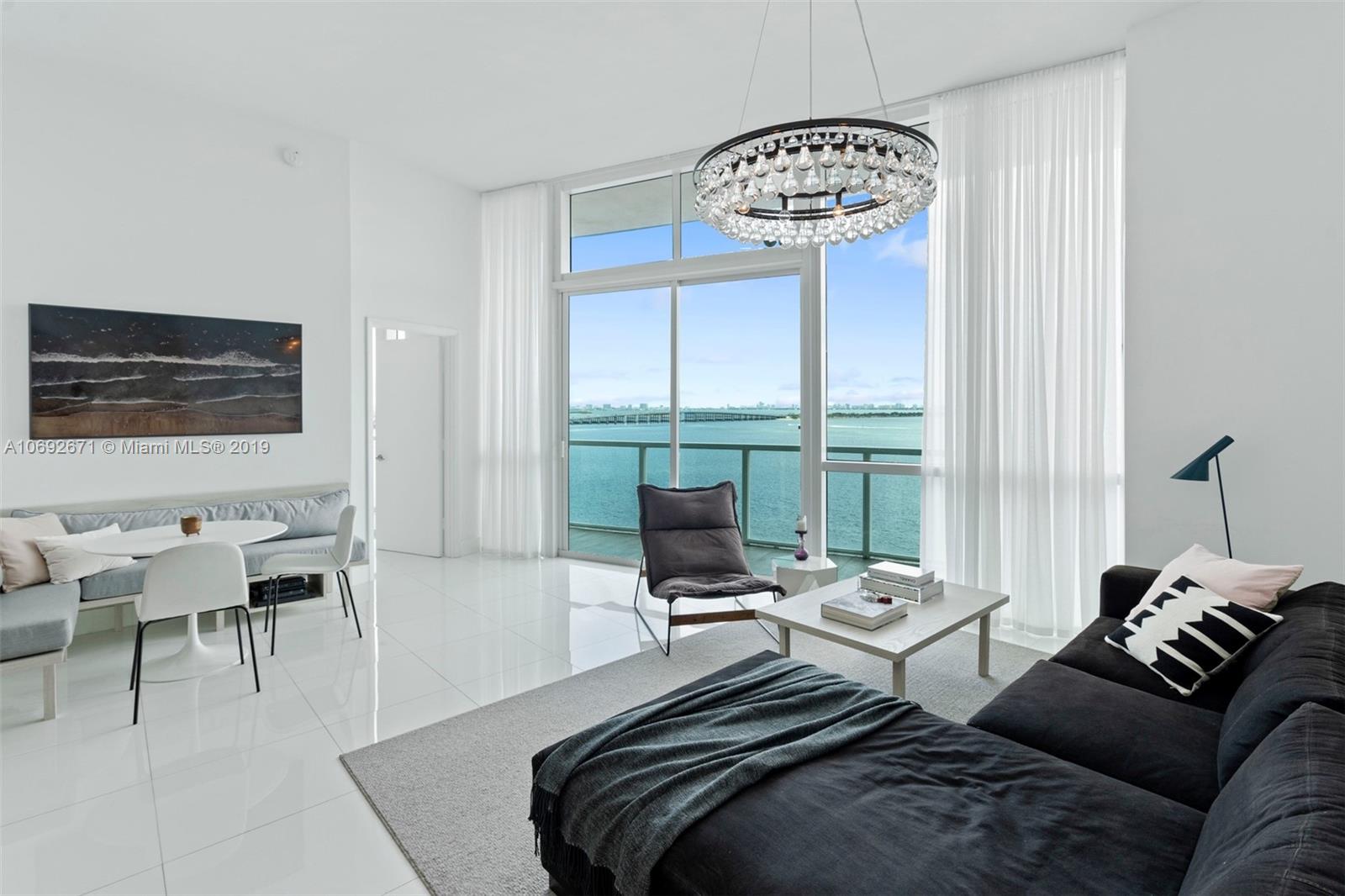 665 Northeast 25th Street, Unit 802 Miami, FL 33137 - Photo 3 of 24 a bedroom with furniture and a window