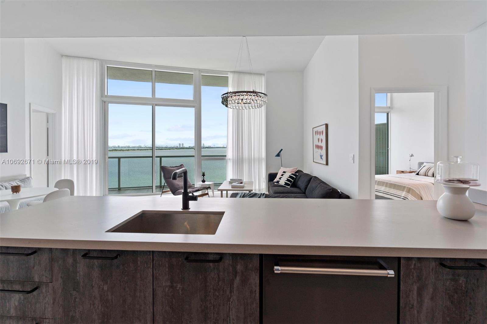665 Northeast 25th Street, Unit 802 Miami, FL 33137 - Photo 7 of 24 a kitchen with a sink and a window