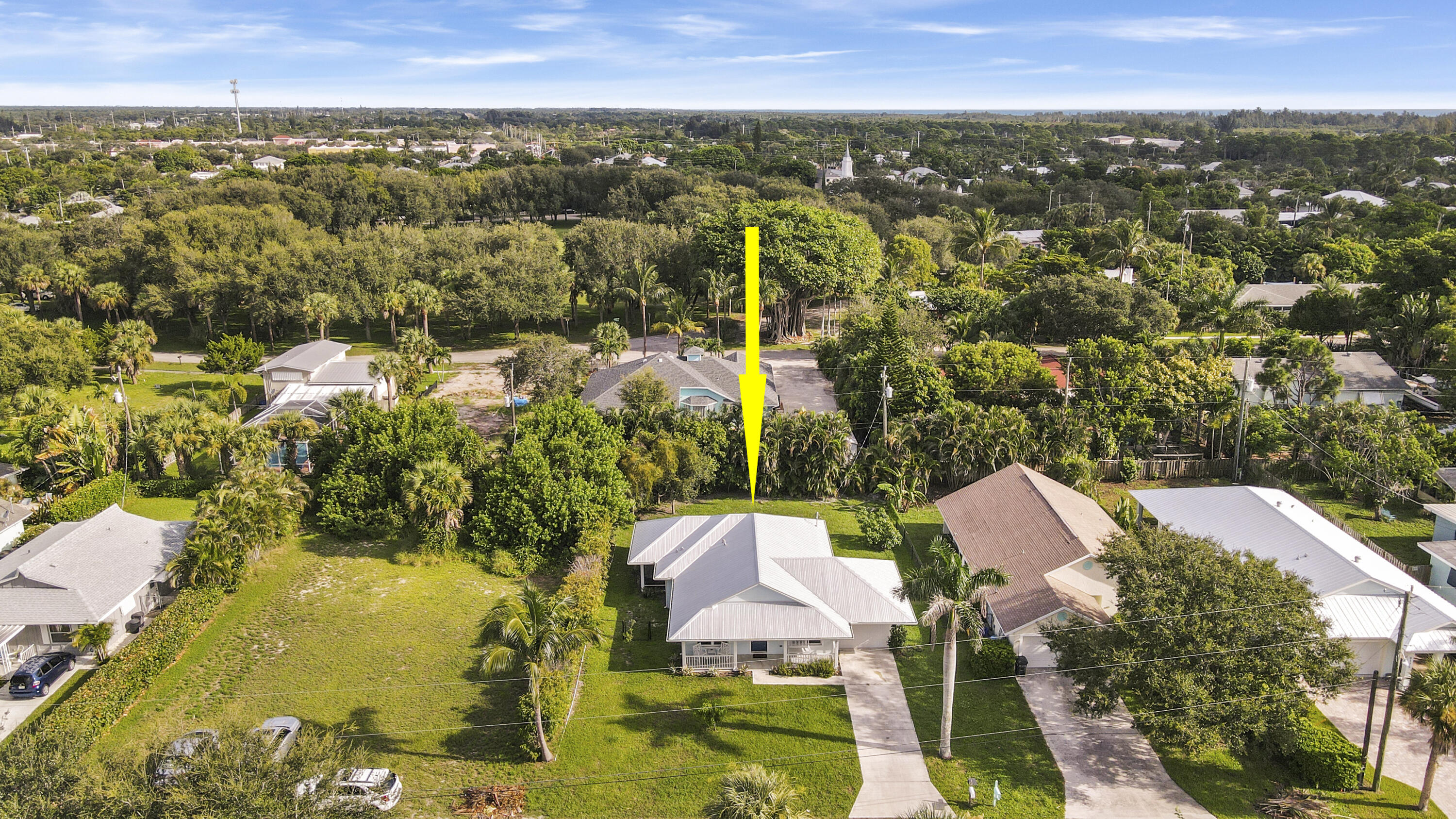 9155 Southeast Athena Street Hobe Sound, FL 33455 - Photo 22 of 25 an aerial view of residential houses with outdoor space