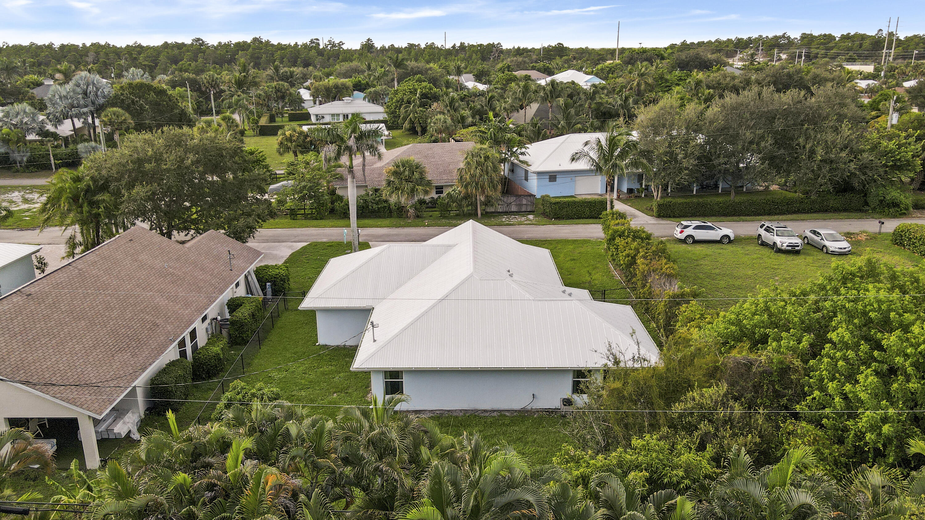 9155 Southeast Athena Street Hobe Sound, FL 33455 - Photo 24 of 25 an aerial view of a house with pool yard and outdoor seating