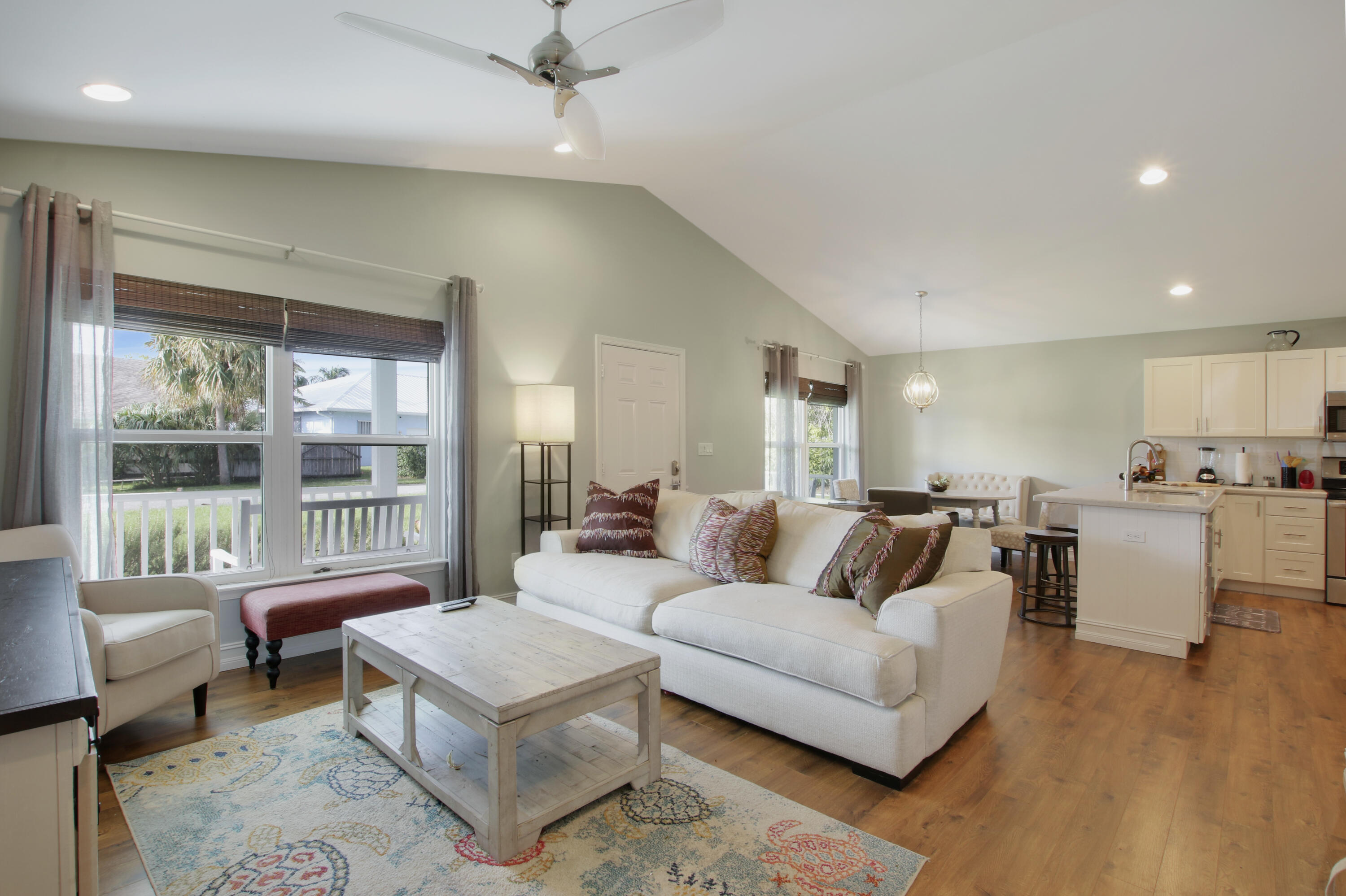 9155 Southeast Athena Street Hobe Sound, FL 33455 - Photo 6 of 25 a living room with furniture and a large window