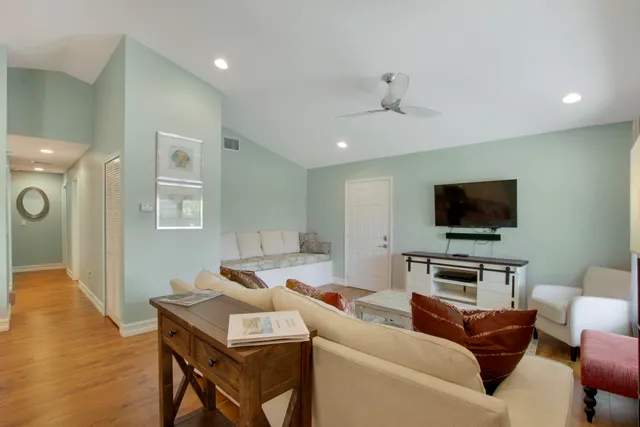 a living room with furniture and a flat screen tv