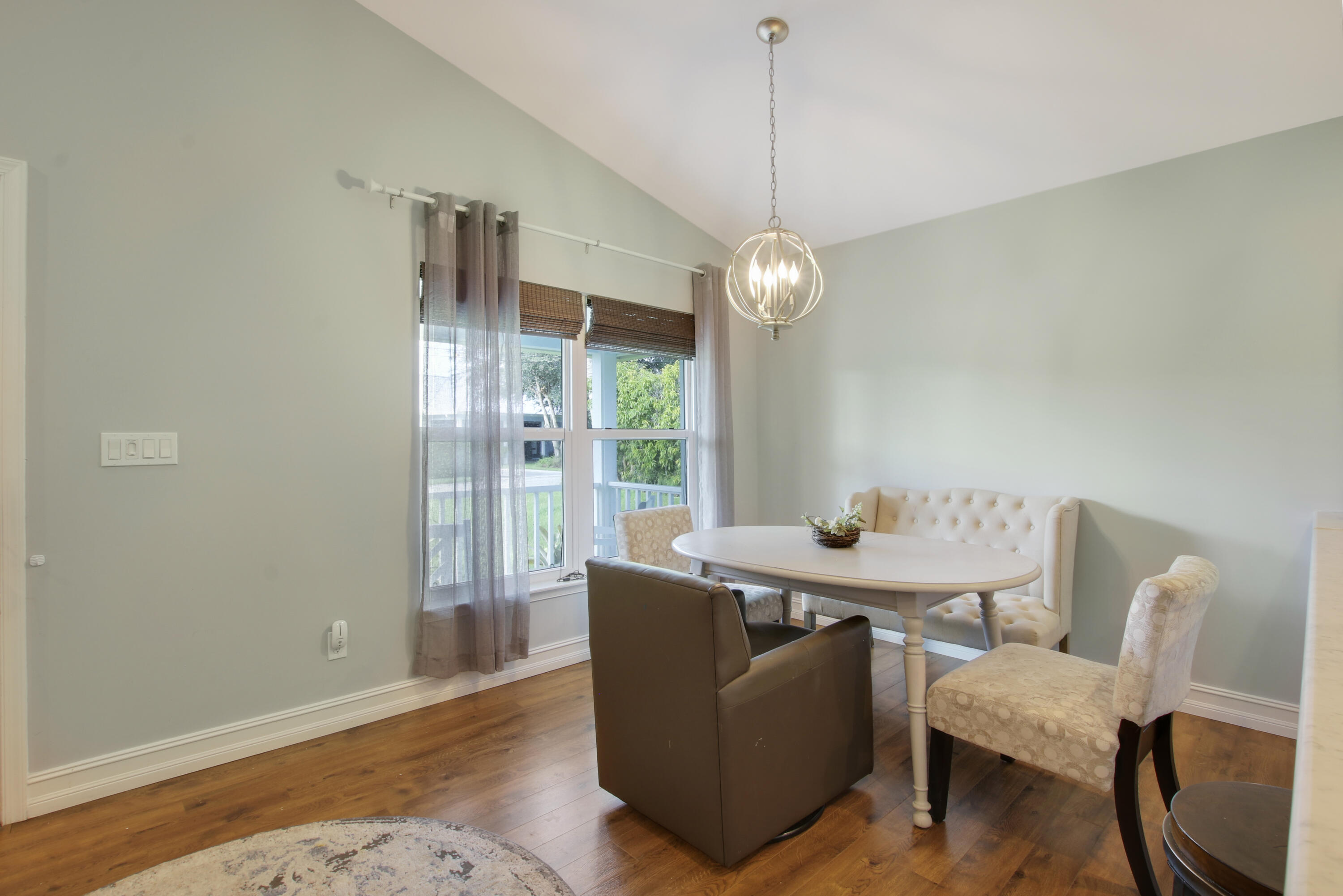9155 Southeast Athena Street Hobe Sound, FL 33455 - Photo 10 of 25 a view of a dining room with furniture window and outside view