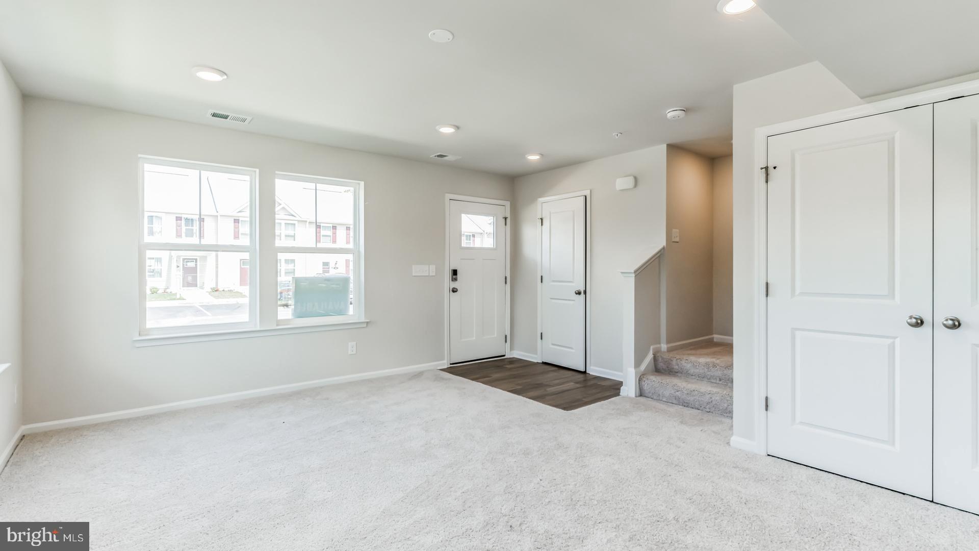 601 Widgeon Way Cambridge, MD 21613 - Photo 6 of 17 wooden floor in an empty room with a window