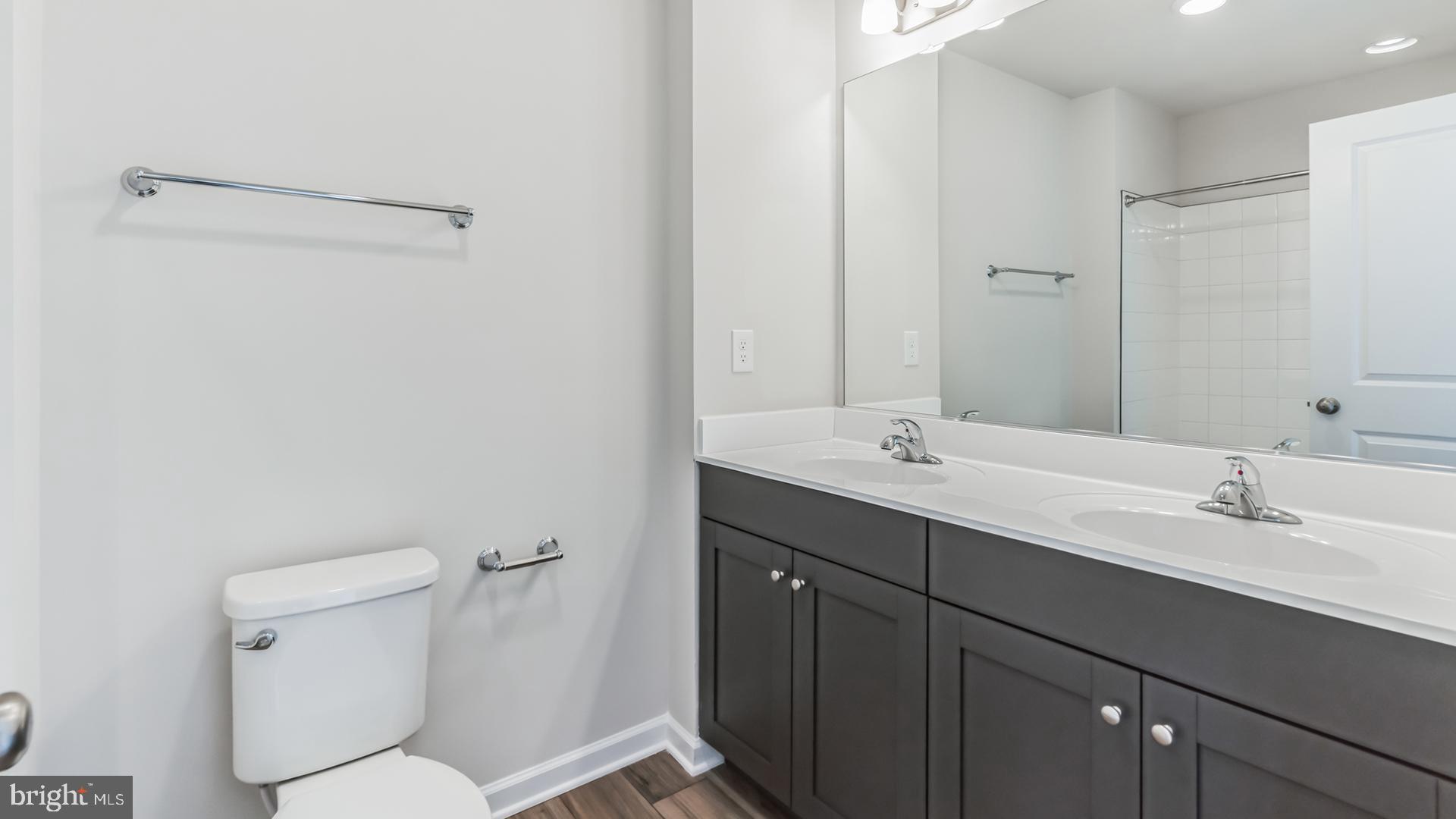601 Widgeon Way Cambridge, MD 21613 - Photo 10 of 17 a bathroom with a sink a toilet and shower