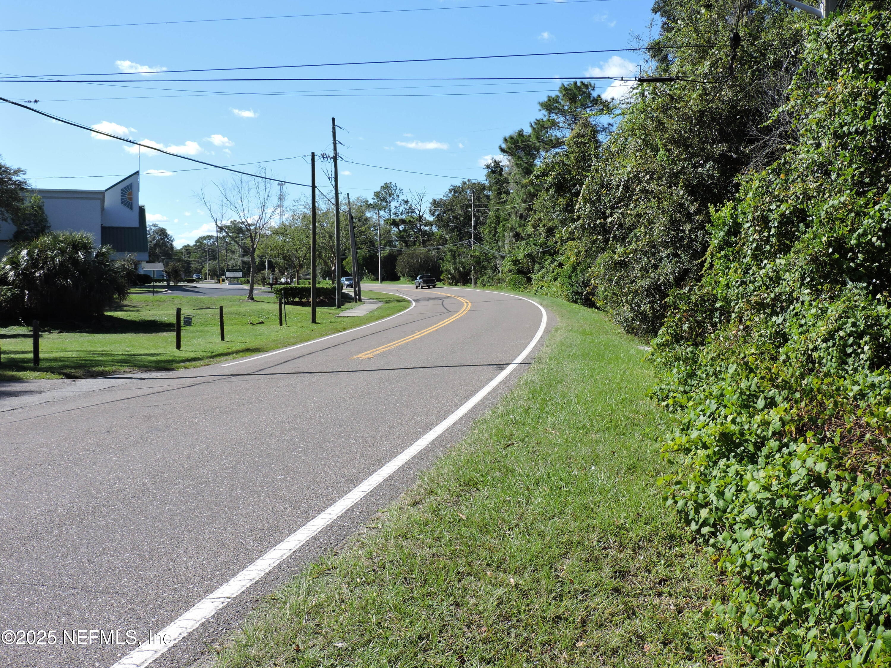 2955-2935 New Berlin Road Jacksonville, FL 32226 - Photo 2 of 78 a view of a house with a big yard and potted plants