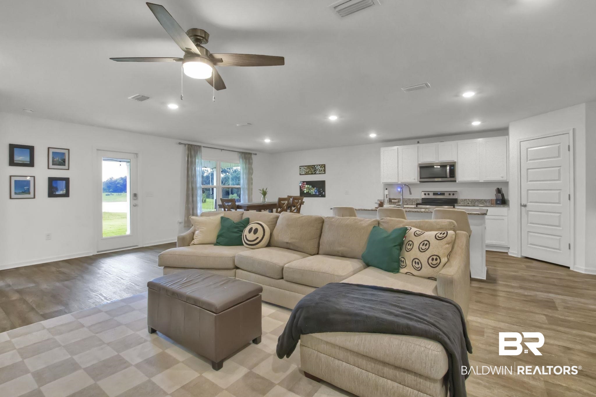 23810 Unbridled Loop Daphne, AL 36526 - Photo 10 of 50 Living room with ceiling fan, sink, and light hardwood / wood-style flooring