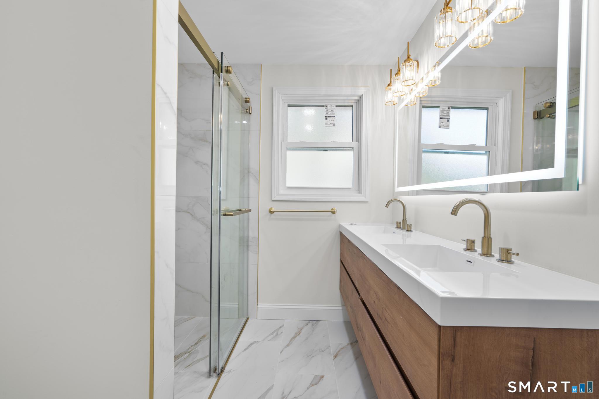 26 Quaddick Town Farm Road Thompson, CT 06277 - Photo 13 of 32 a bathroom with a double vanity sink mirror and