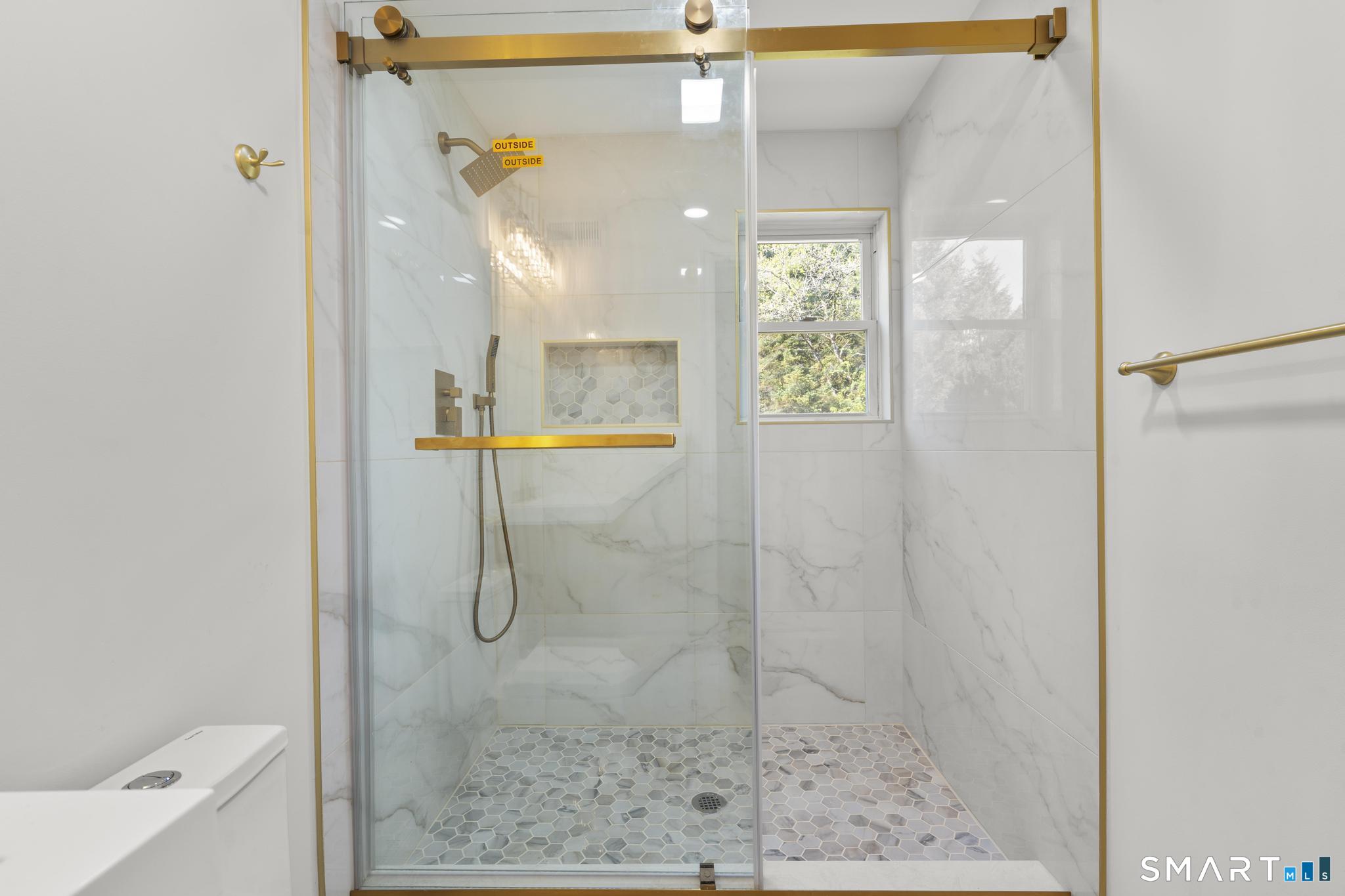 26 Quaddick Town Farm Road Thompson, CT 06277 - Photo 22 of 32 a bathroom with a glass shower door