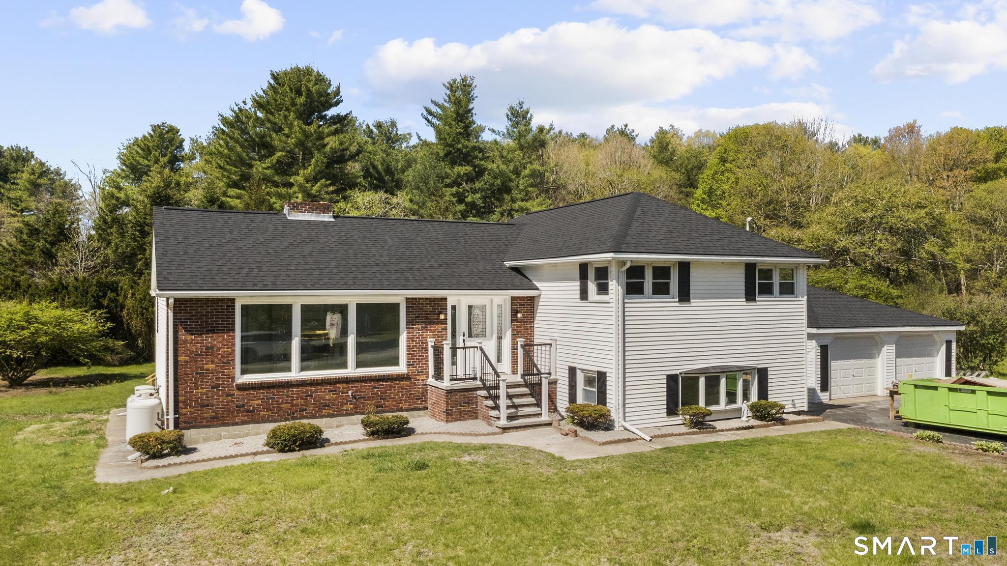 26 Quaddick Town Farm Road Thompson, CT 06277 - Photo 29 of 32 a house view with a garden space