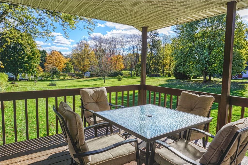 403 Meridian Road Butler, PA 16001 - Photo 4 of 25 a view of a patio with a table chairs and a backyard