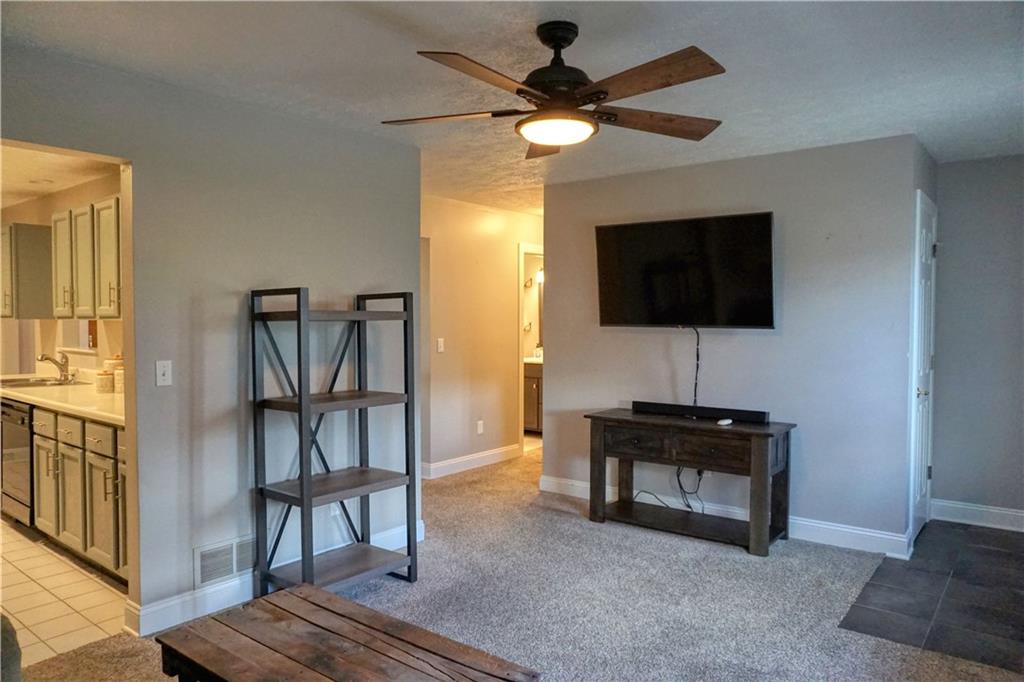 403 Meridian Road Butler, PA 16001 - Photo 7 of 25 a living room with furniture and a flat screen tv