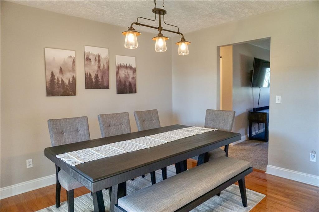 403 Meridian Road Butler, PA 16001 - Photo 8 of 25 a view of a dining room with furniture and wooden floor