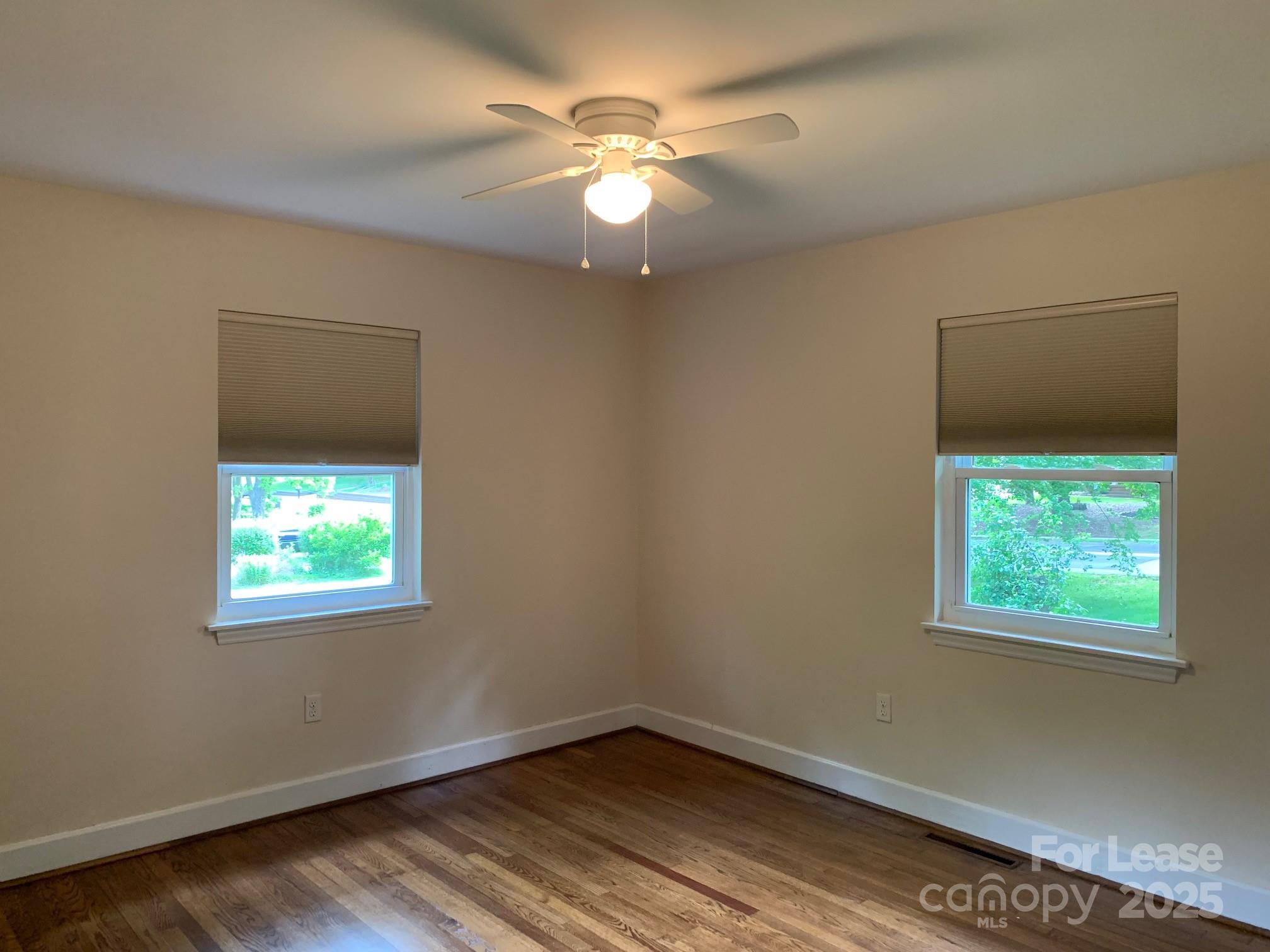 422 Fieldstone Road Mooresville, NC 28115 - Photo 17 of 30 an empty room with window and a ceiling fan