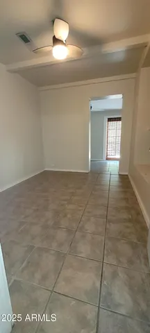 a view of an empty room and window