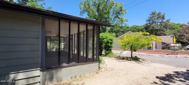 a couple of potted plants in front of door
