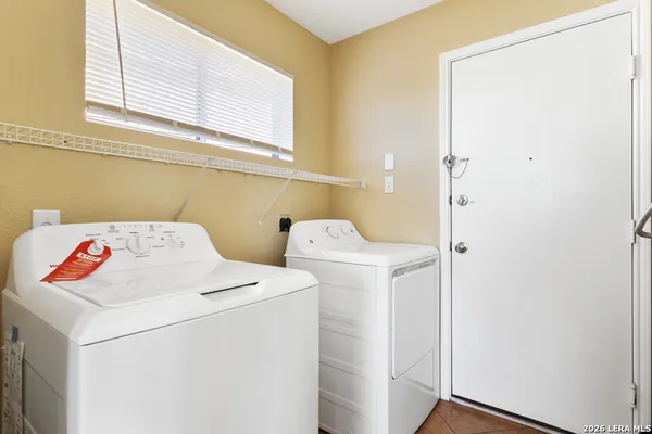 a utility room with dryer and washer