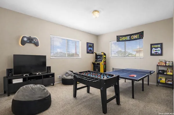 a room with furniture and a flat screen tv
