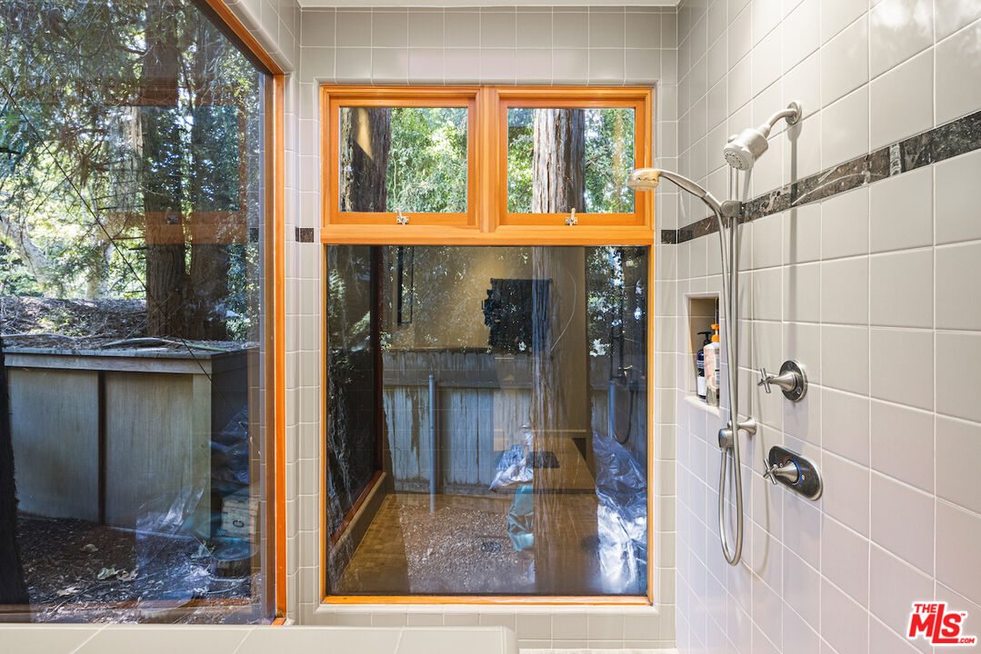 780 Brooktree Road Pacific Palisades, CA 90272 - Photo 1 of 1 a front view of a house with a glass door