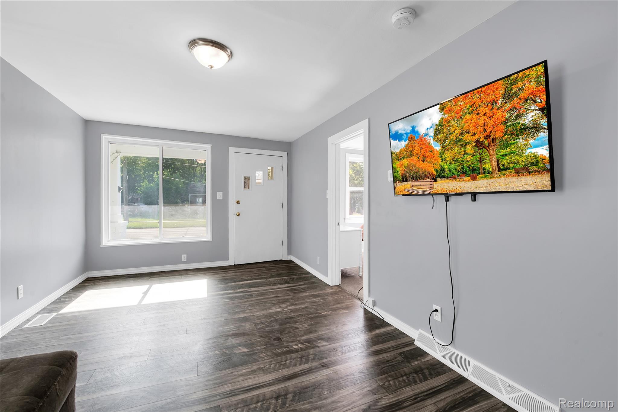 58925 Haven Ridge Road New Haven, MI 48048 - Photo 8 of 22 Entrance foyer with dark wood-style floors and healthy amount of natural light