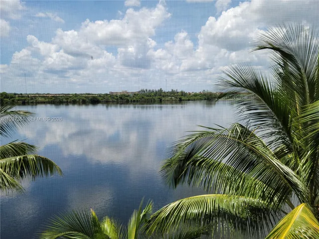 a view of a swimming pool with a lawn chairs