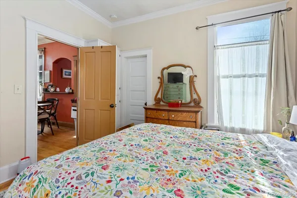 a bedroom with a bed and a dresser