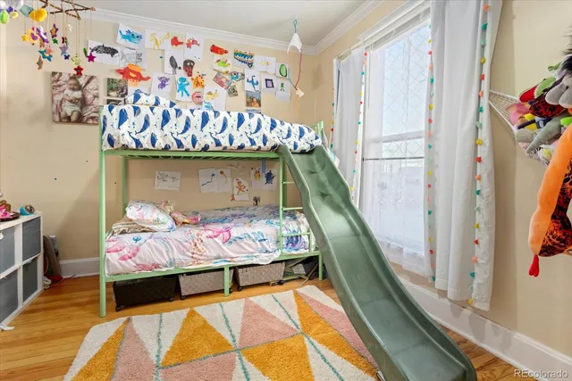 a bedroom with bed and window