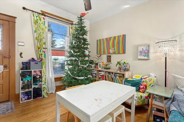 a view of a dining room with furniture and wooden floor