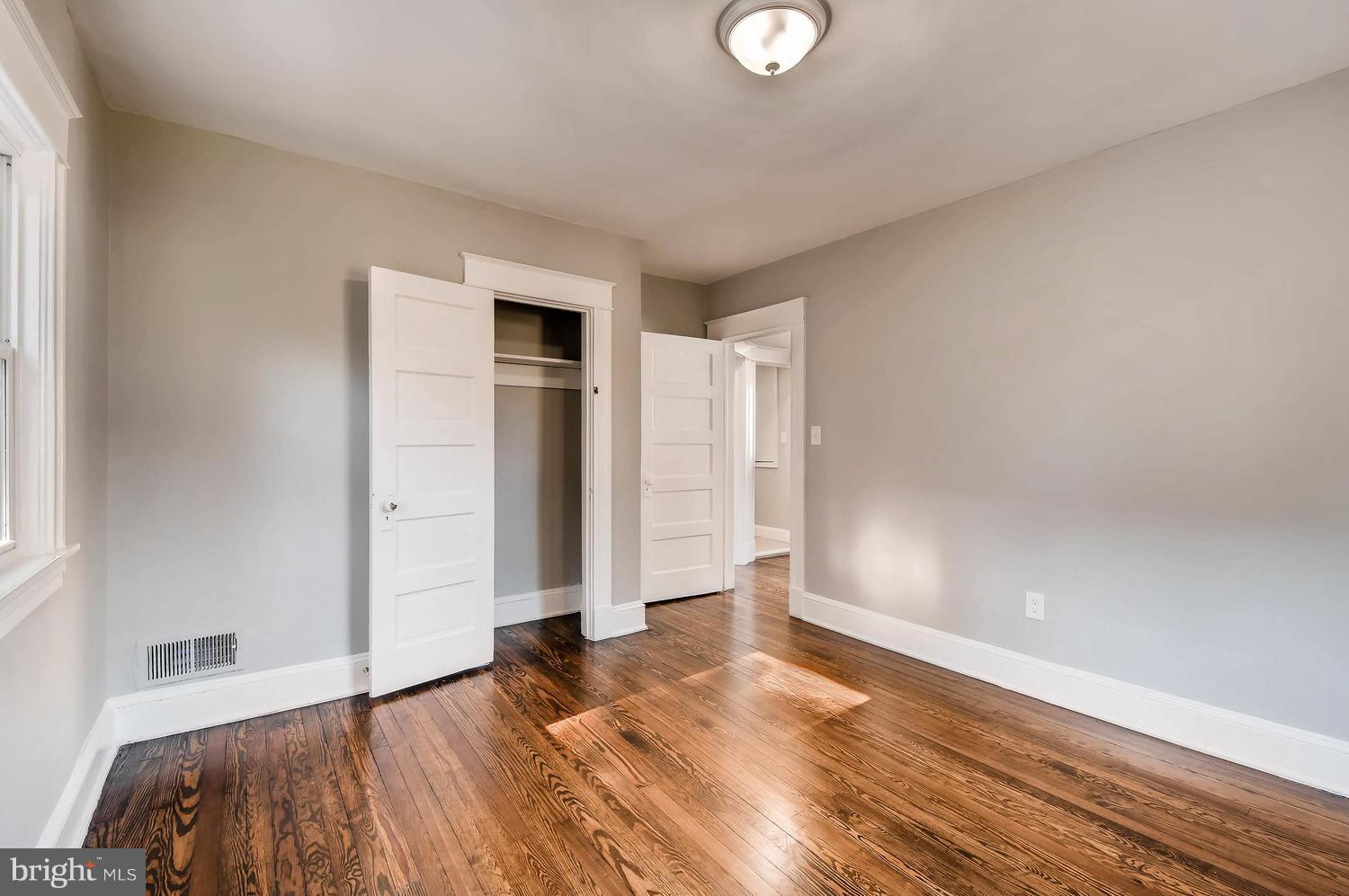 6315 Banbury Road Baltimore, MD 21239 - Photo 22 of 29 a view of empty room with wooden floor