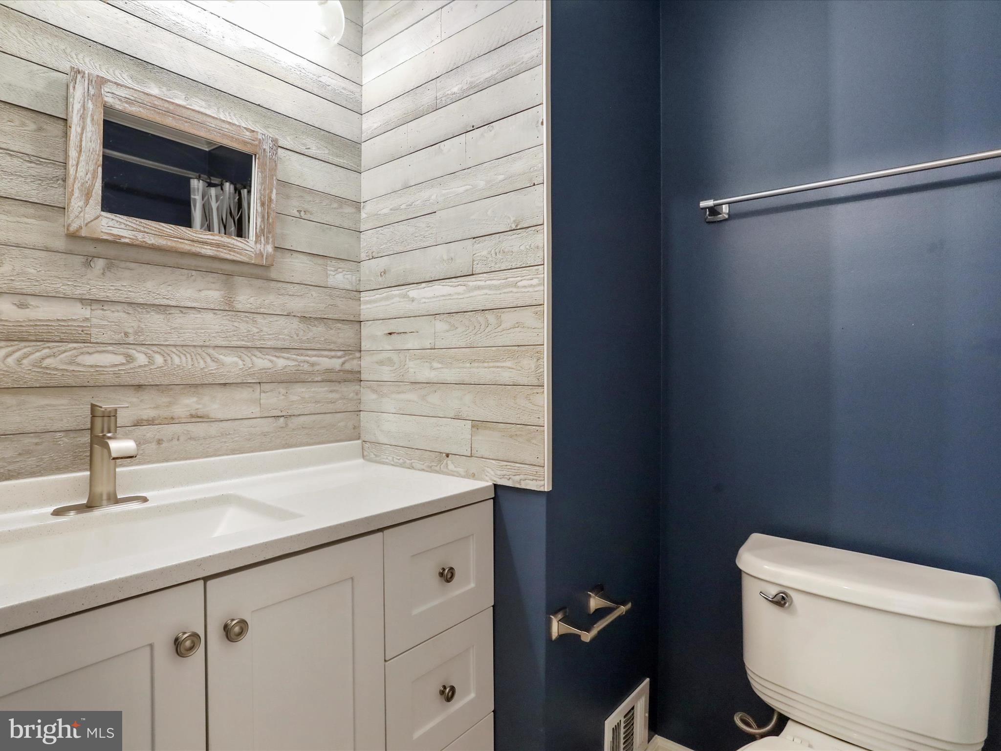 6910 Compton Valley Court Centreville, VA 20121 - Photo 28 of 37 a bathroom with a sink and a toilet