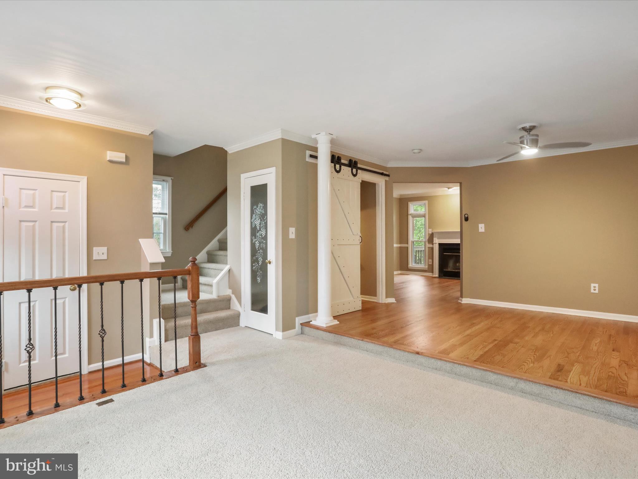 6910 Compton Valley Court Centreville, VA 20121 - Photo 3 of 37 a view of a hallway with wooden floor and entryway
