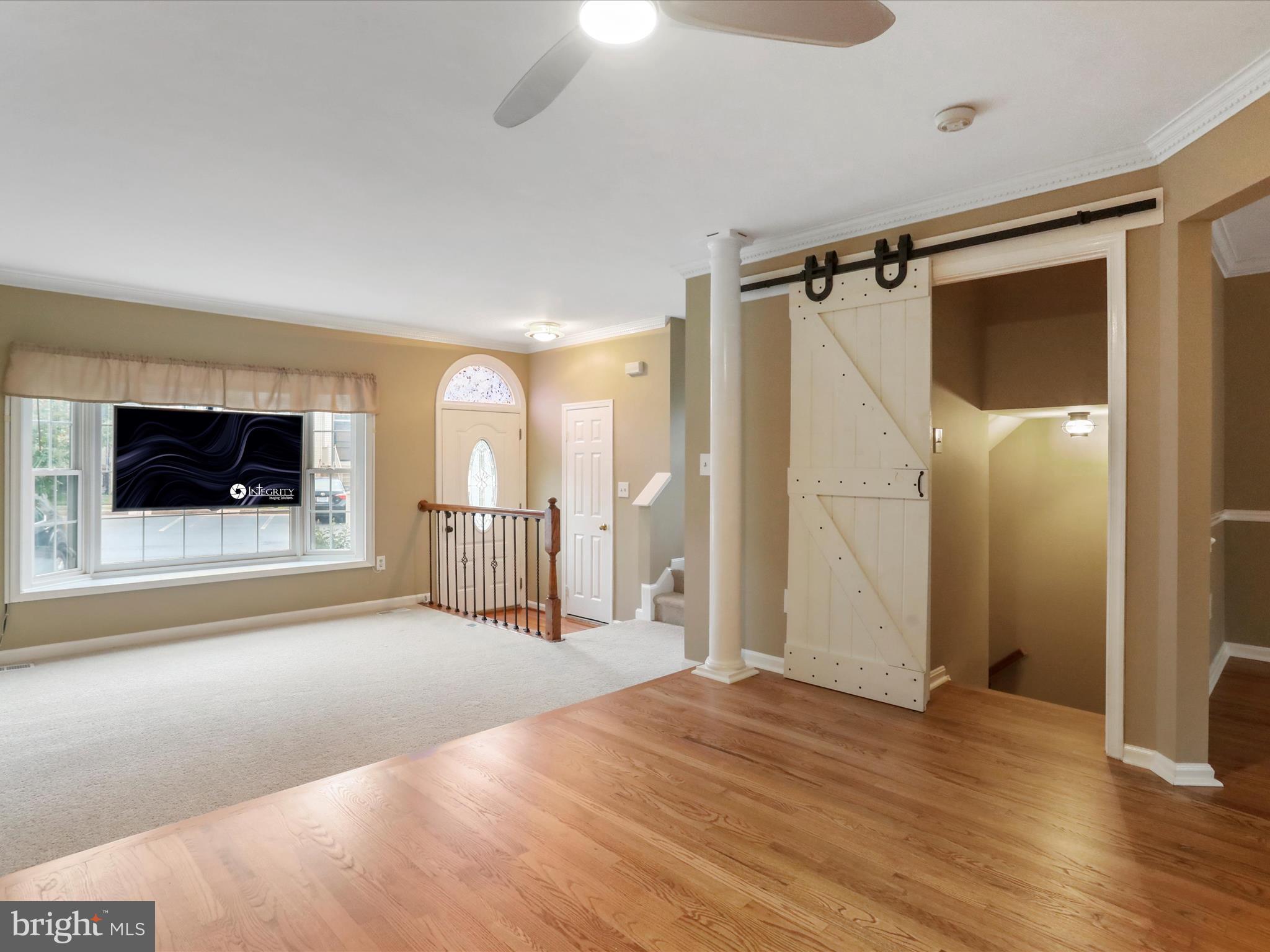 6910 Compton Valley Court Centreville, VA 20121 - Photo 5 of 37 a view of a room with wooden floor and a bathroom