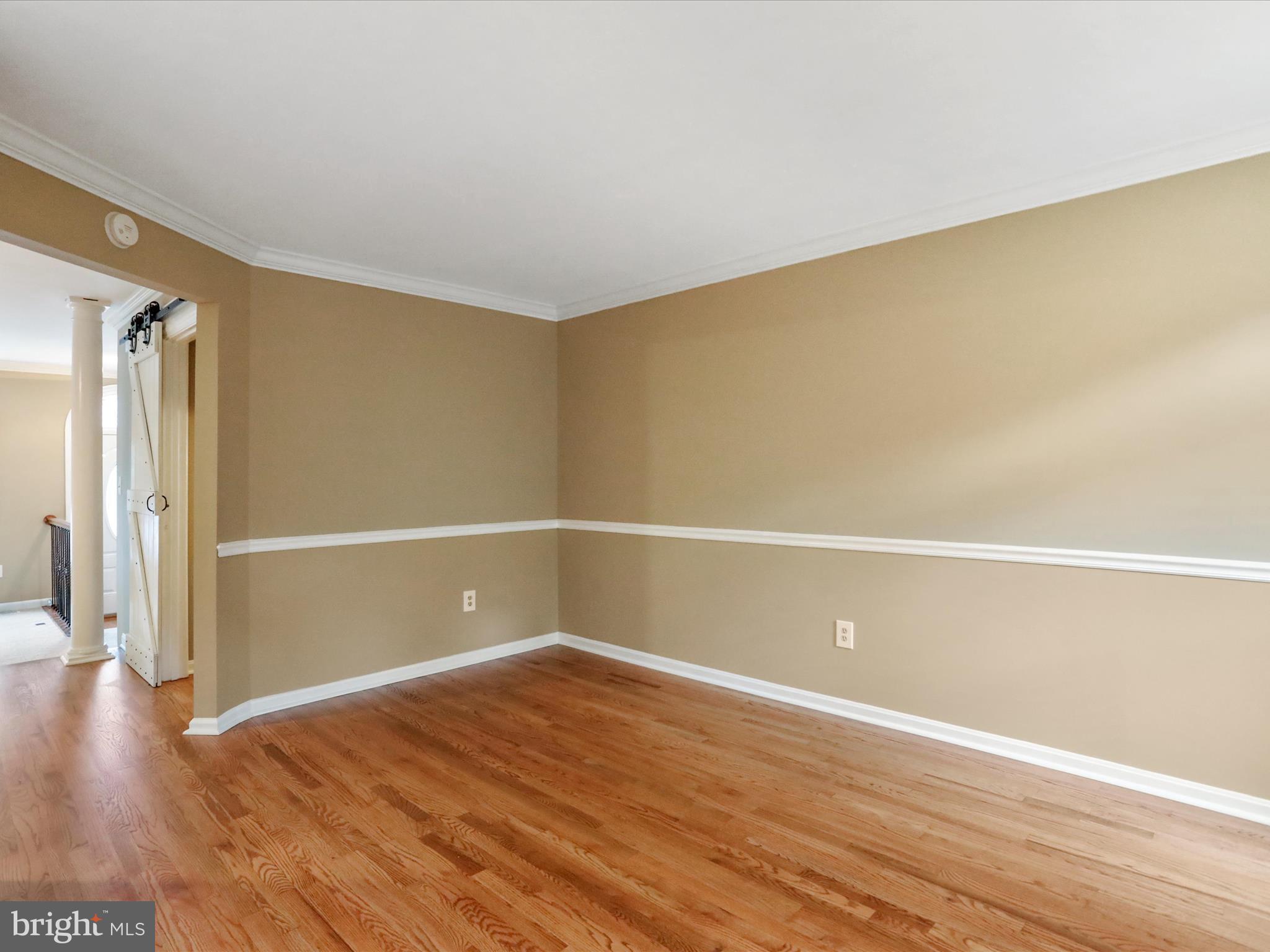 6910 Compton Valley Court Centreville, VA 20121 - Photo 6 of 37 a view of an empty room with wooden floor