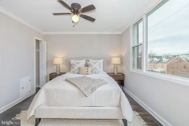 a bedroom with a bed and window