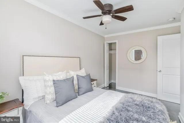 a bedroom with a bed and a lamp