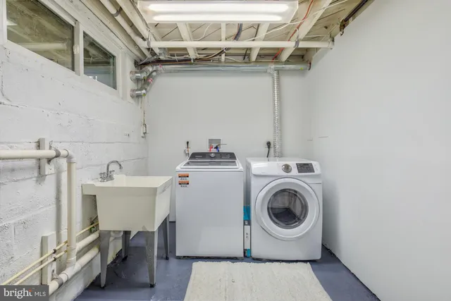 a utility room with dryer and washer
