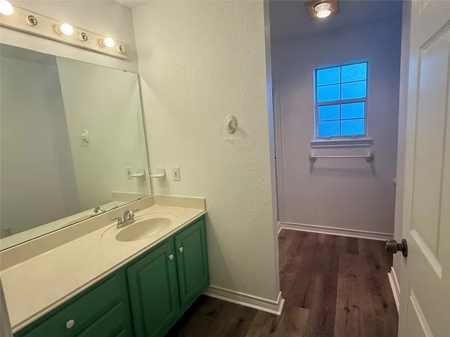 a bathroom with a sink double vanity and a mirror