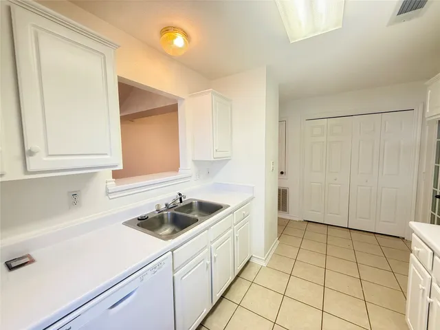a kitchen that has a sink and a stove