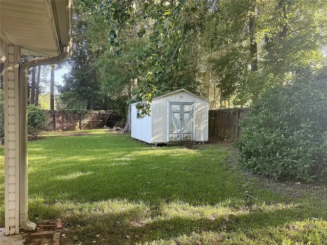 a backyard of a house with lots of green space