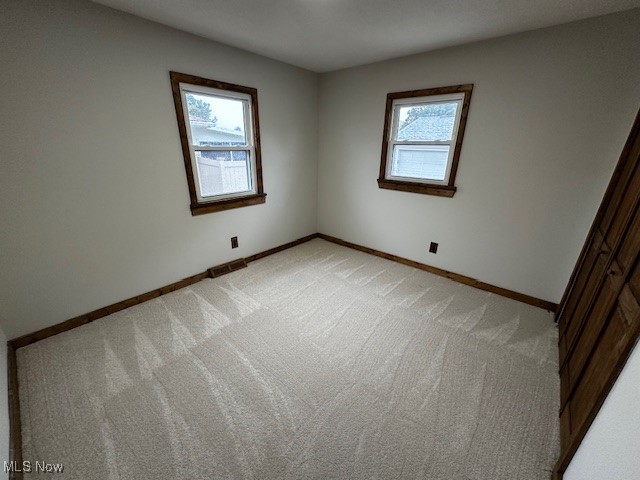 586 Ingalls Road Akron, OH 44312 - Photo 9 of 21 Unfurnished bedroom with carpet floors and baseboards