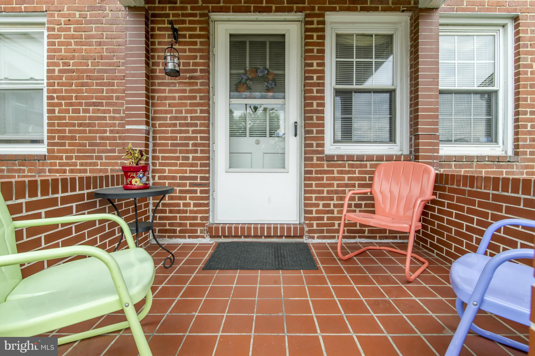 6906 Broening Road Dundalk, MD 21222 - Photo 2 of 29 a view of a door with a chair and a window