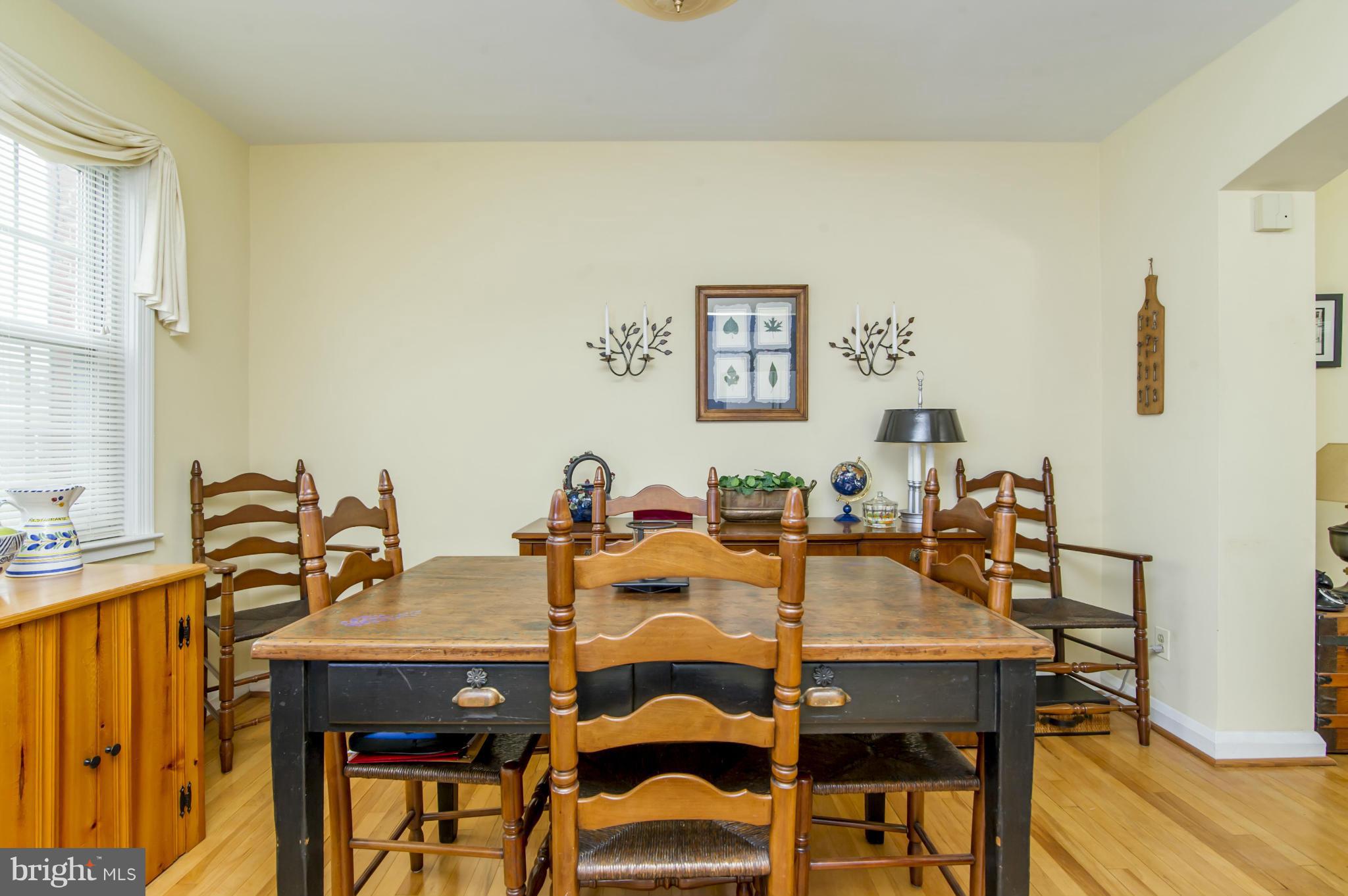 6906 Broening Road Dundalk, MD 21222 - Photo 9 of 29 a view of a dining room with furniture and wooden floor