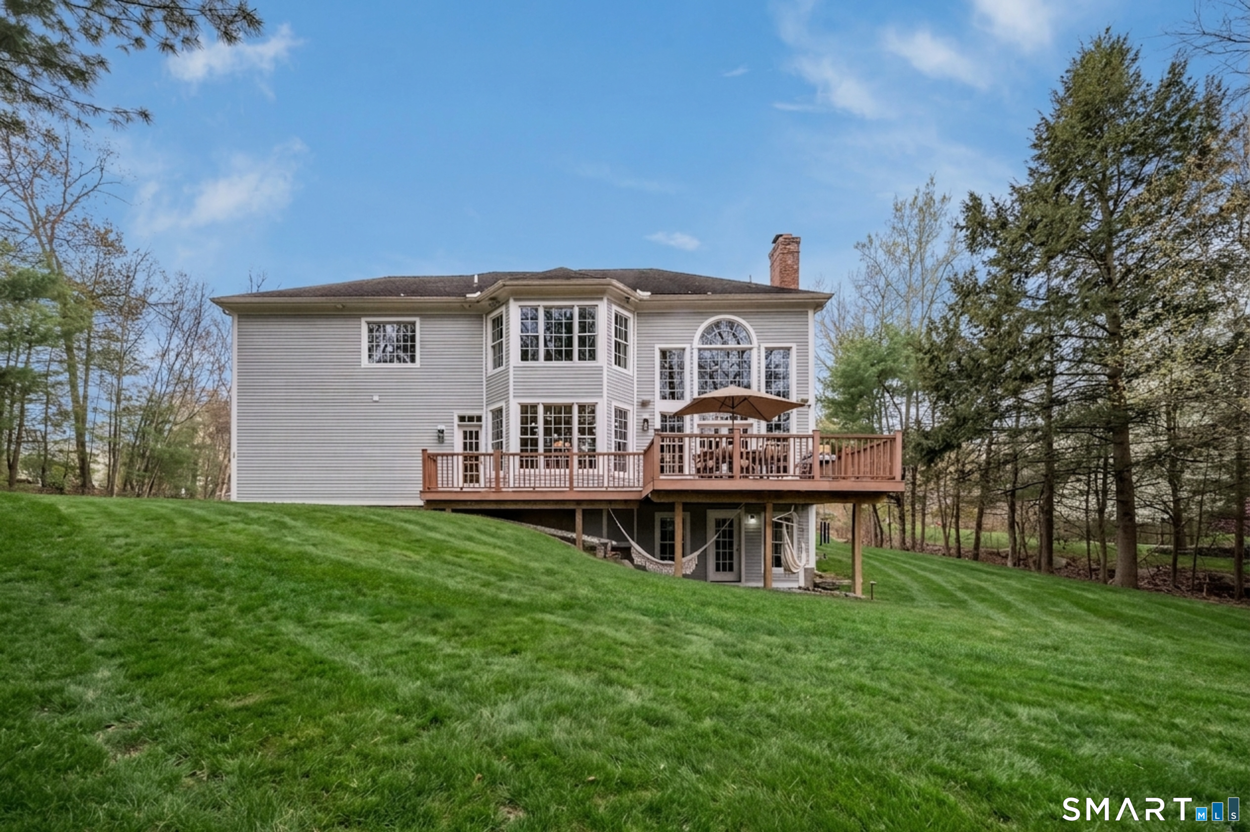 4 Collins View Road Canton, CT 06019 - Photo 12 of 38 a view of a house with a big yard and large trees