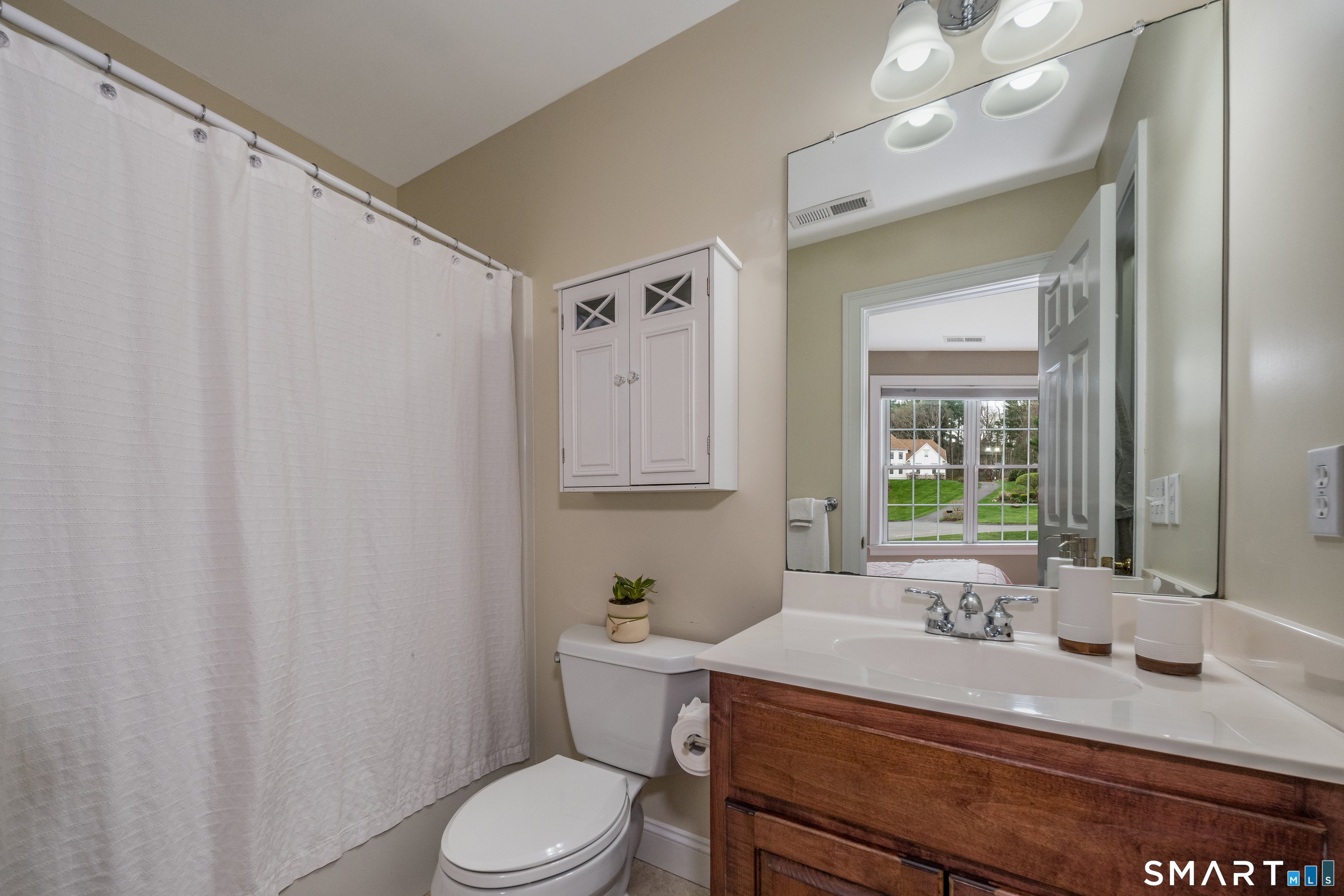 4 Collins View Road Canton, CT 06019 - Photo 23 of 38 a bathroom with a granite countertop sink mirror vanity and toilet