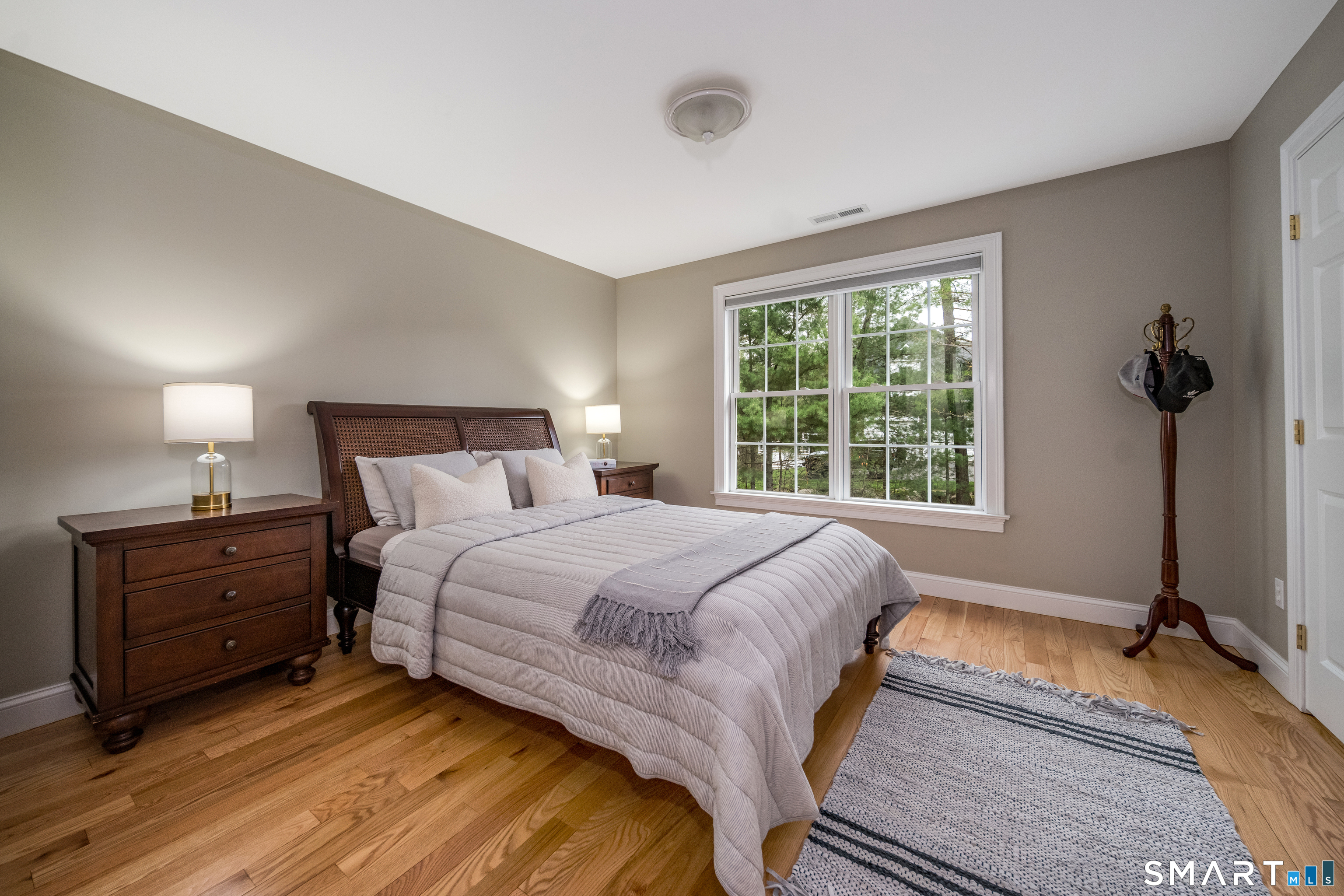 4 Collins View Road Canton, CT 06019 - Photo 24 of 38 a bedroom with a bed and a mirror